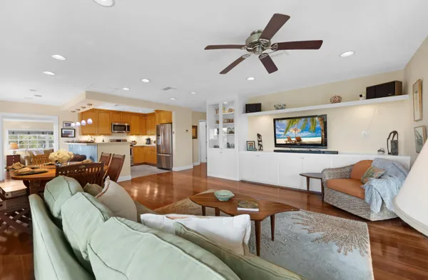 a large kitchen with a table and chairs
