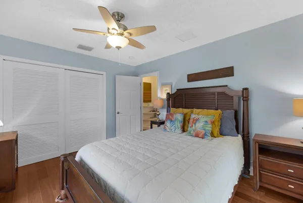 a living room with lots of furniture and clutter