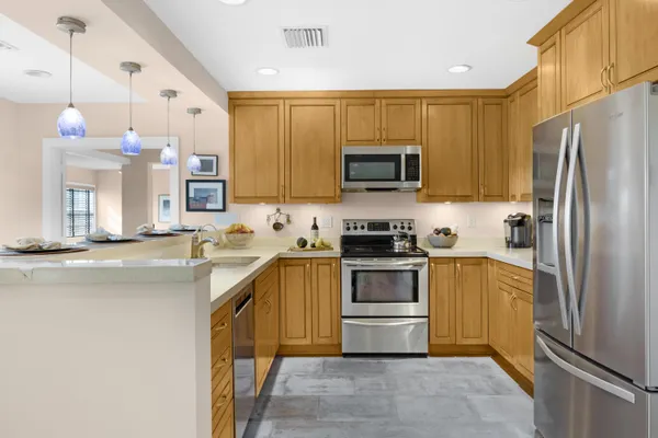 a bathroom with a sink a toilet and shower curtain