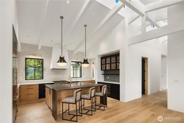 a kitchen with a counter space a sink and cabinets