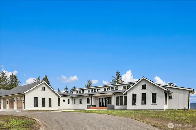 a view of house with yard and entertaining space