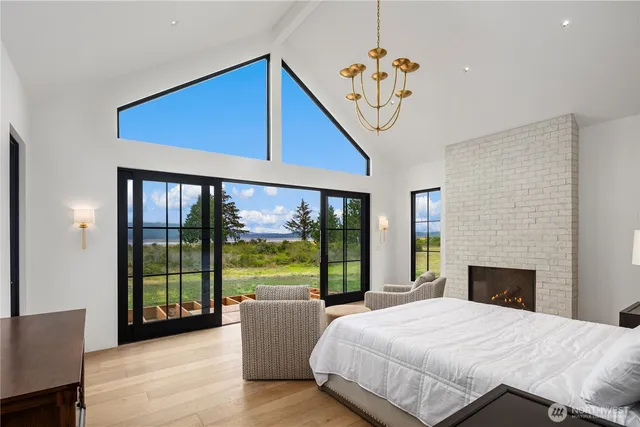 a living room with furniture and large window