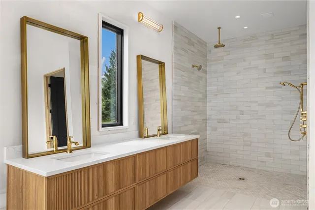 a white bath tub sitting in front of a window