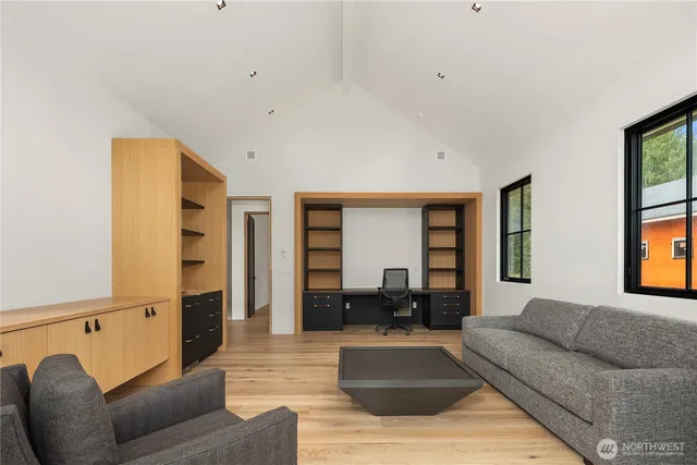 a view of a hallway with wooden shelves and chandelier