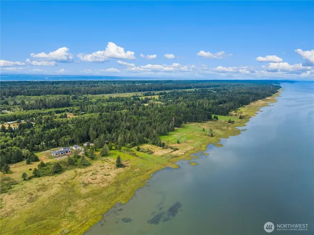 a view of a lake with a big yard