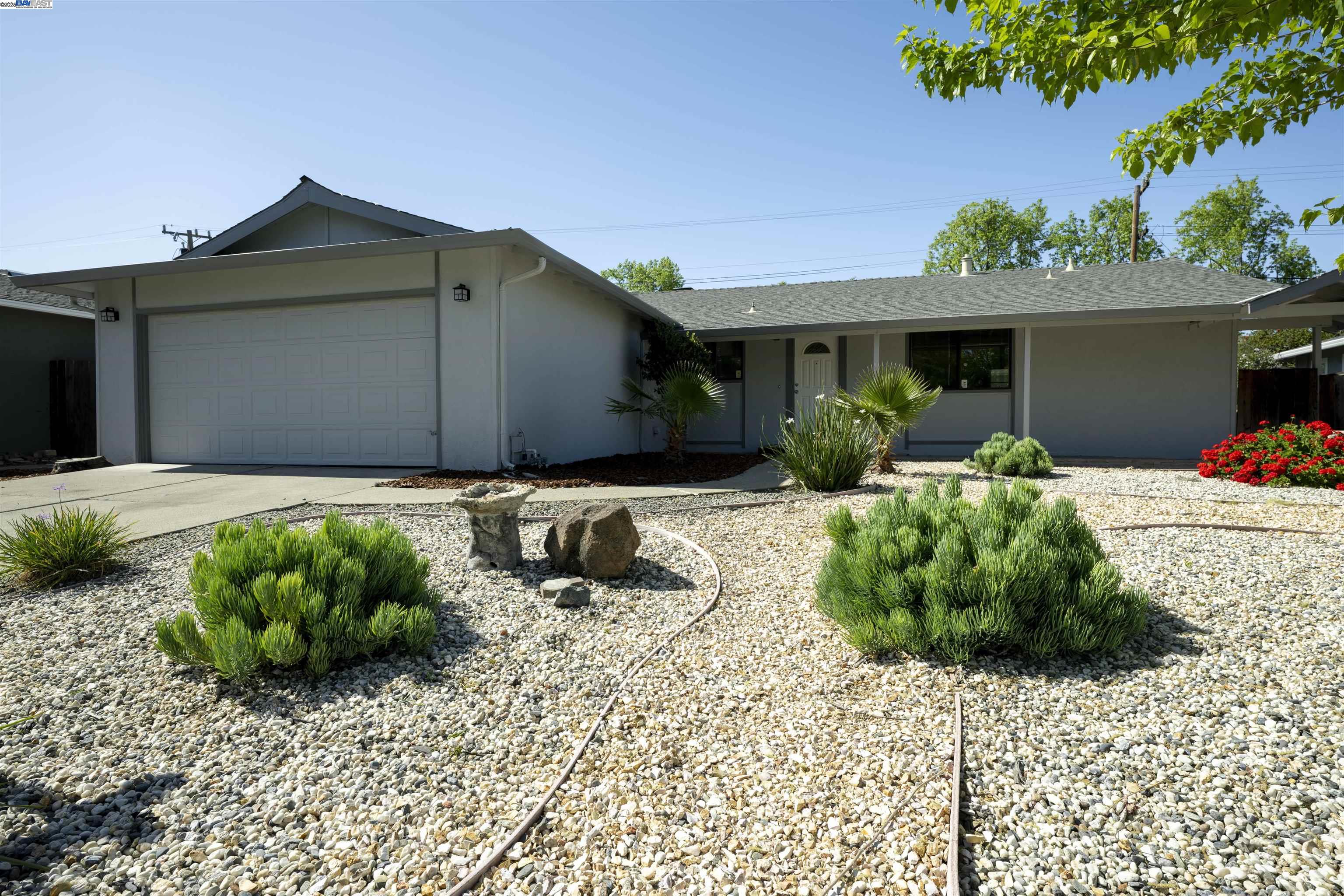 4650 Regina Lane Concord, CA 94521 - Photo 1 of 1 a front view of a house with garden