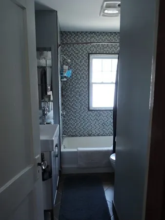 a bathroom with a bathtub and a shower