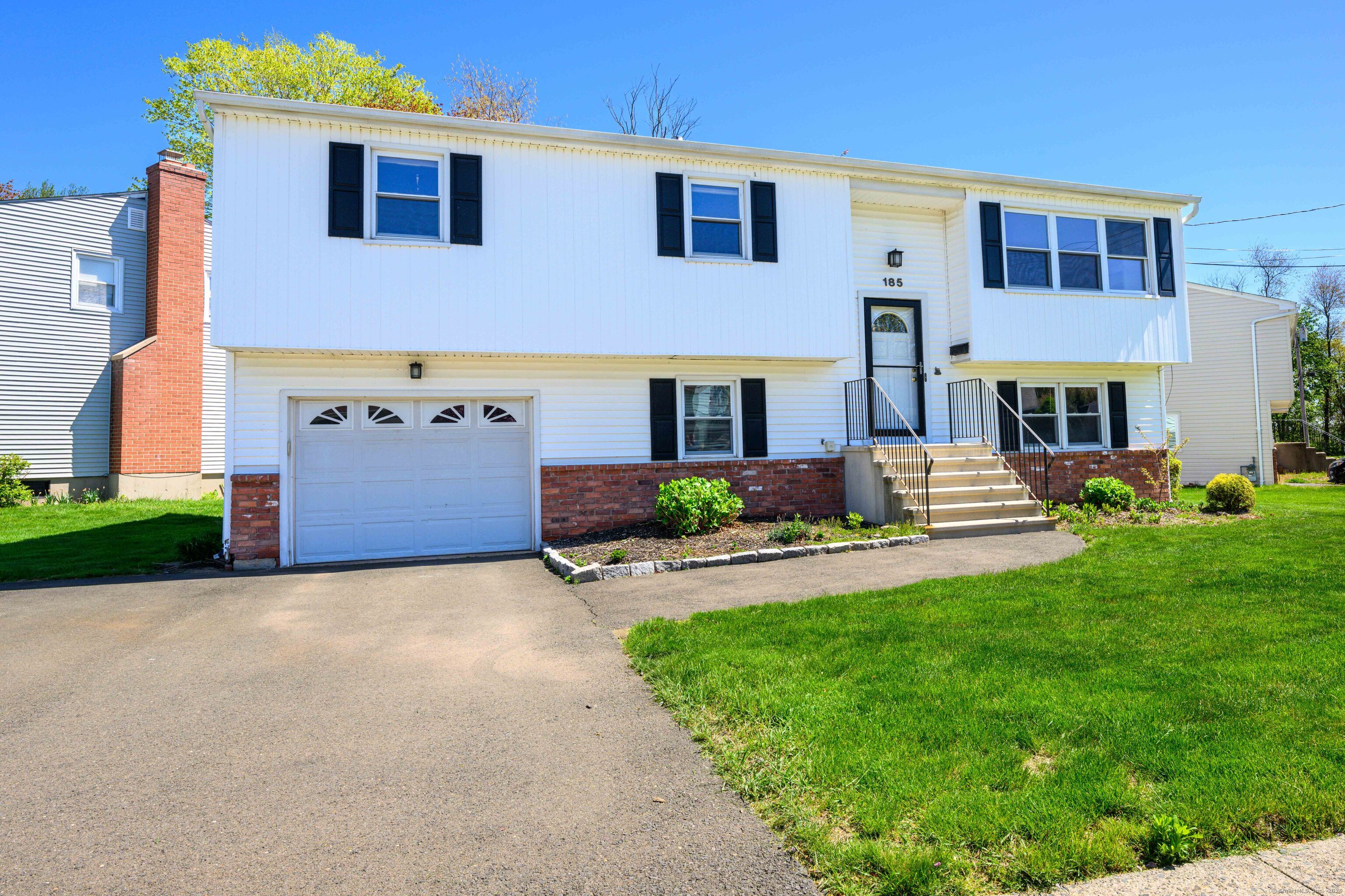Crisp, raised ranch with beautiful lawn!