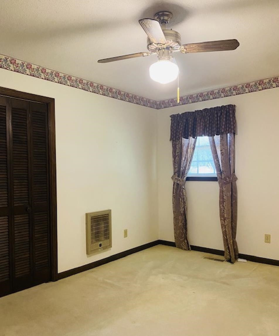109 Morris Drive Rutherford, TN 38369 - Photo 5 of 18 a view of a livingroom with wooden floor and a ceiling fan