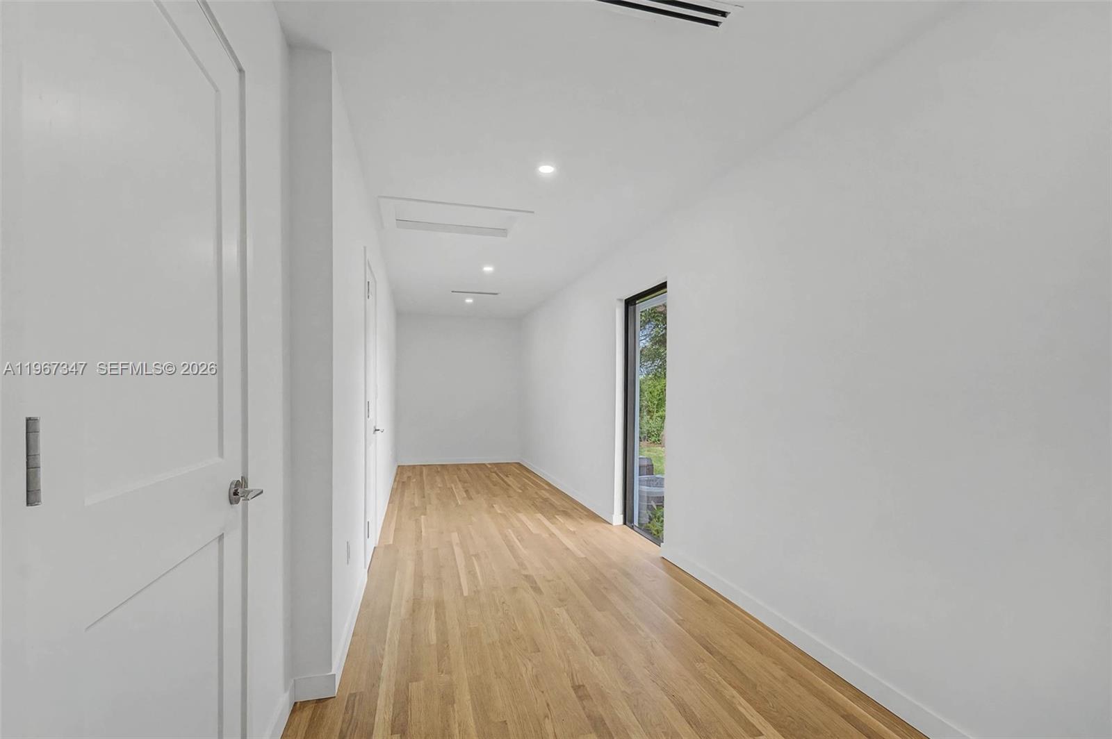 12940 Southwest 73rd Avenue Pinecrest, FL 33156 - Photo 15 of 38 a view of hallway with wooden floor