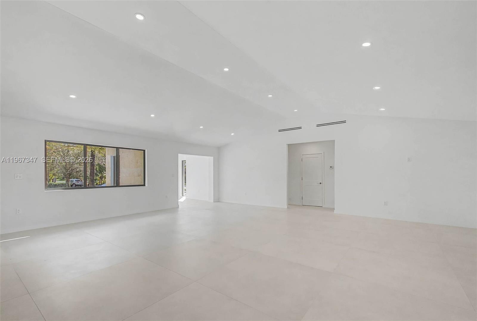 12940 Southwest 73rd Avenue Pinecrest, FL 33156 - Photo 17 of 38 an empty room with windows and ceiling fan