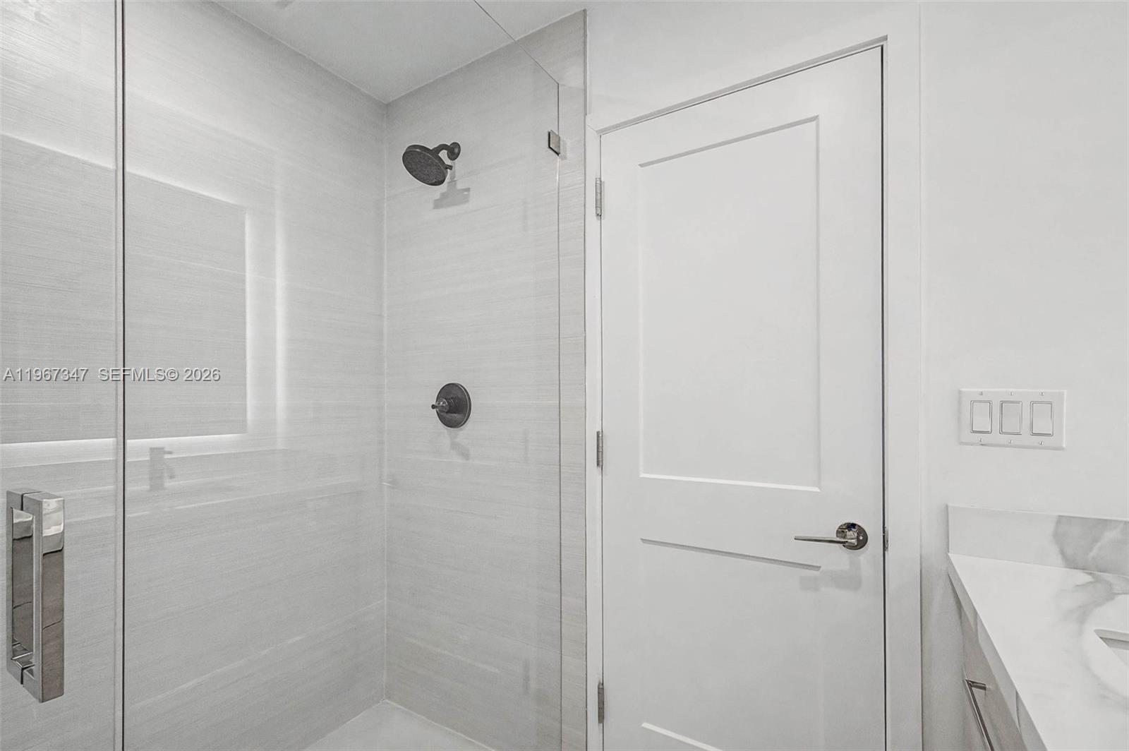 12940 Southwest 73rd Avenue Pinecrest, FL 33156 - Photo 28 of 38 a bathroom with a shower
