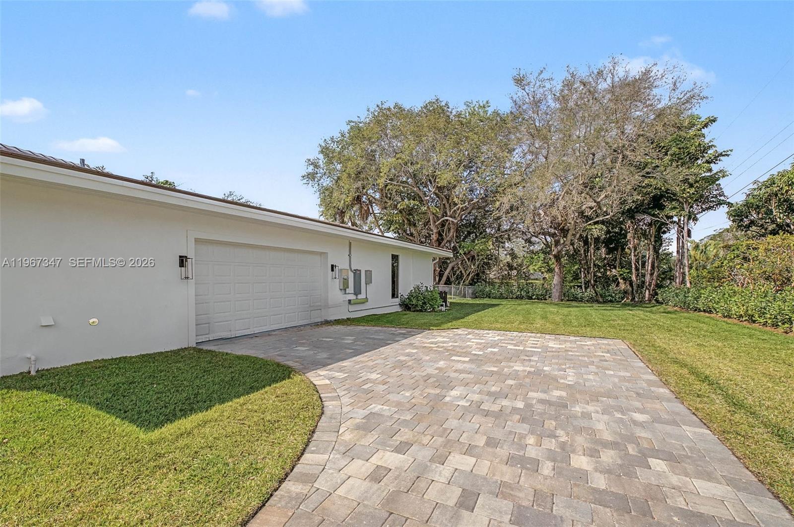 12940 Southwest 73rd Avenue Pinecrest, FL 33156 - Photo 34 of 38 a view of a backyard of the house