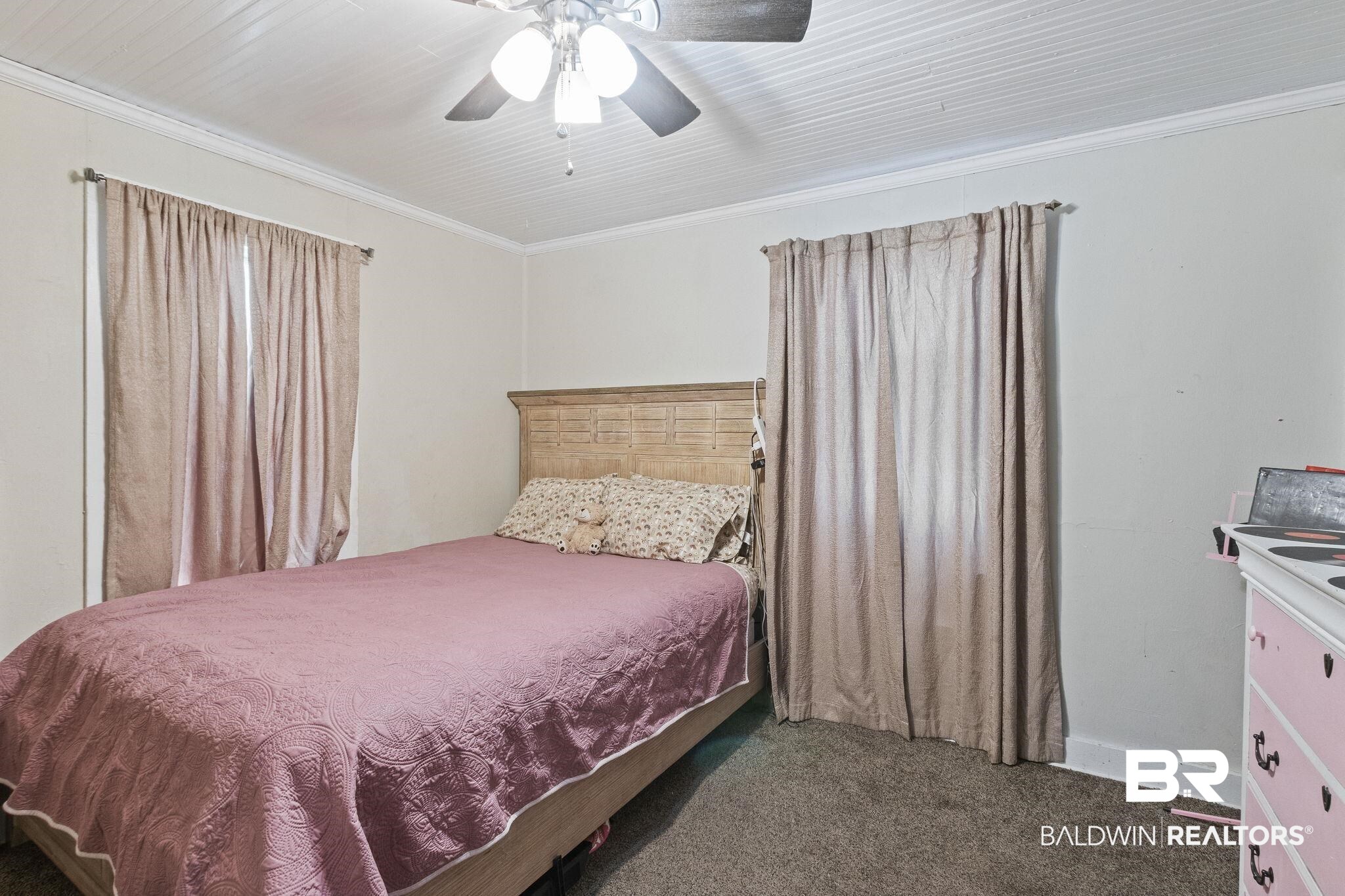 707 North Cedar Street Foley, AL 36535 - Photo 22 of 69 Carpeted bedroom with ceiling fan and crown molding