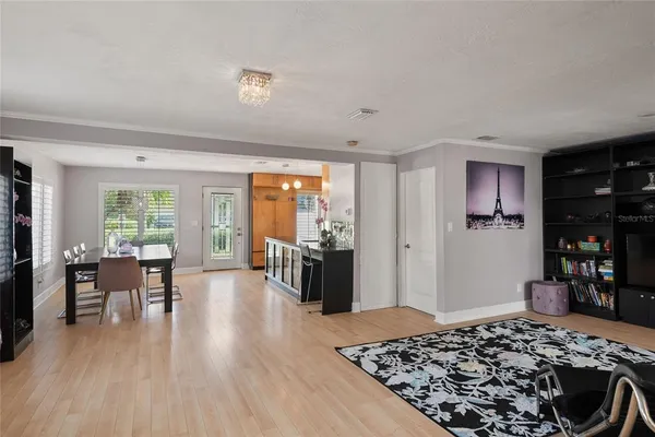 a living room with fireplace furniture and a wooden floor