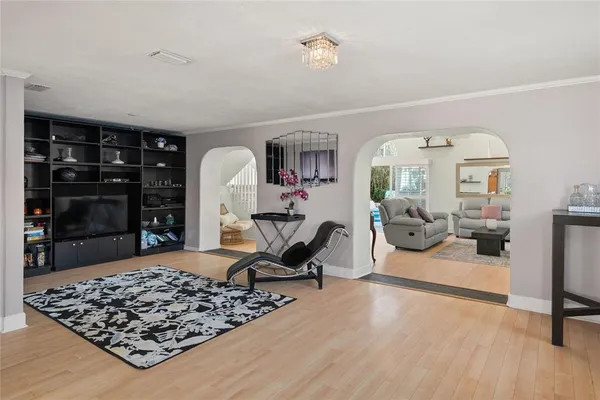 a living room with furniture and a fireplace