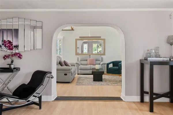 a living room with furniture and stairs