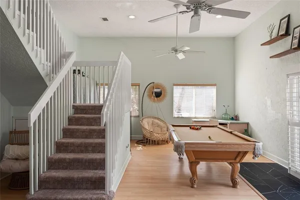 a room with lots of furniture and white walls