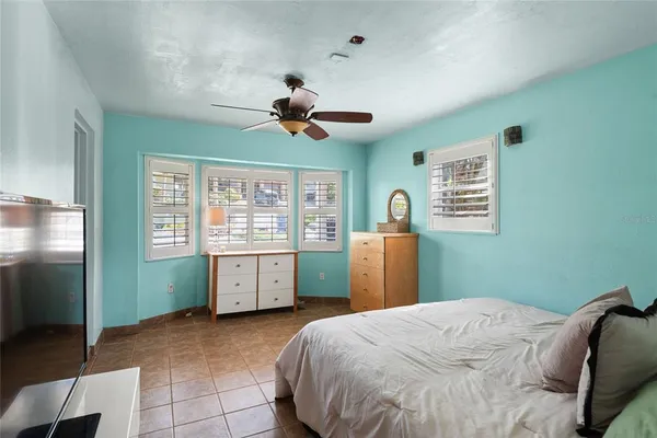 a view of a bathroom with tub and window