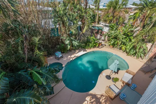 a view of a swimming pool with a yard