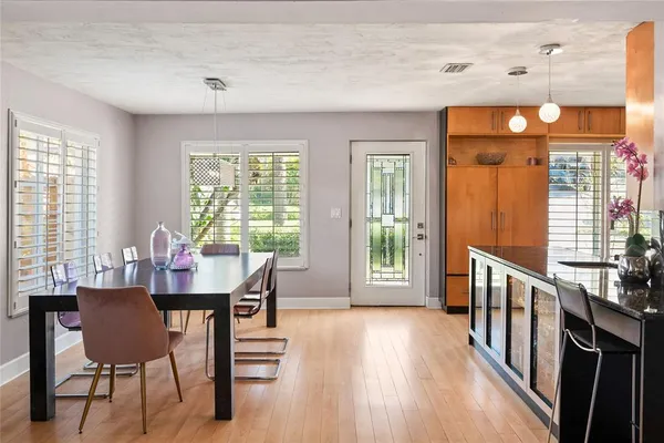 a view of a dining room with furniture window and wooden floor