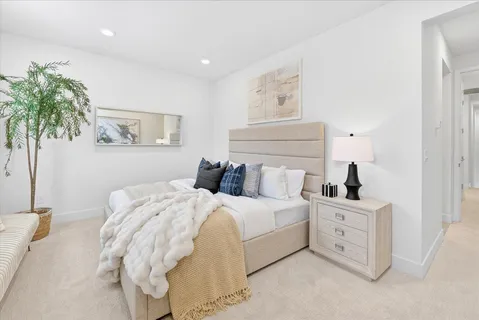 a bedroom with bed and a window