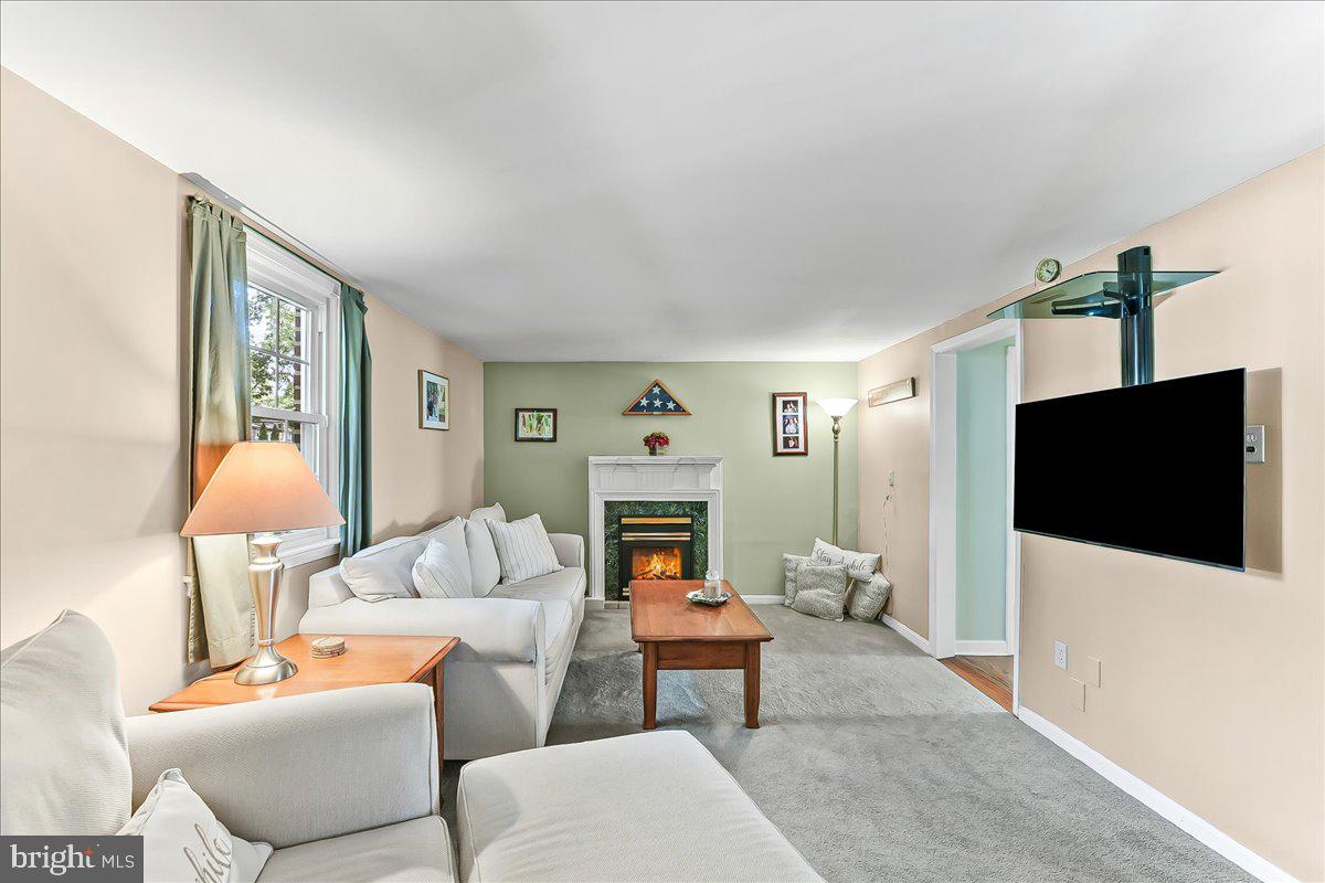243 Rambling Way Springfield, PA 19064 - Photo 12 of 42 a living room with furniture and a flat screen tv