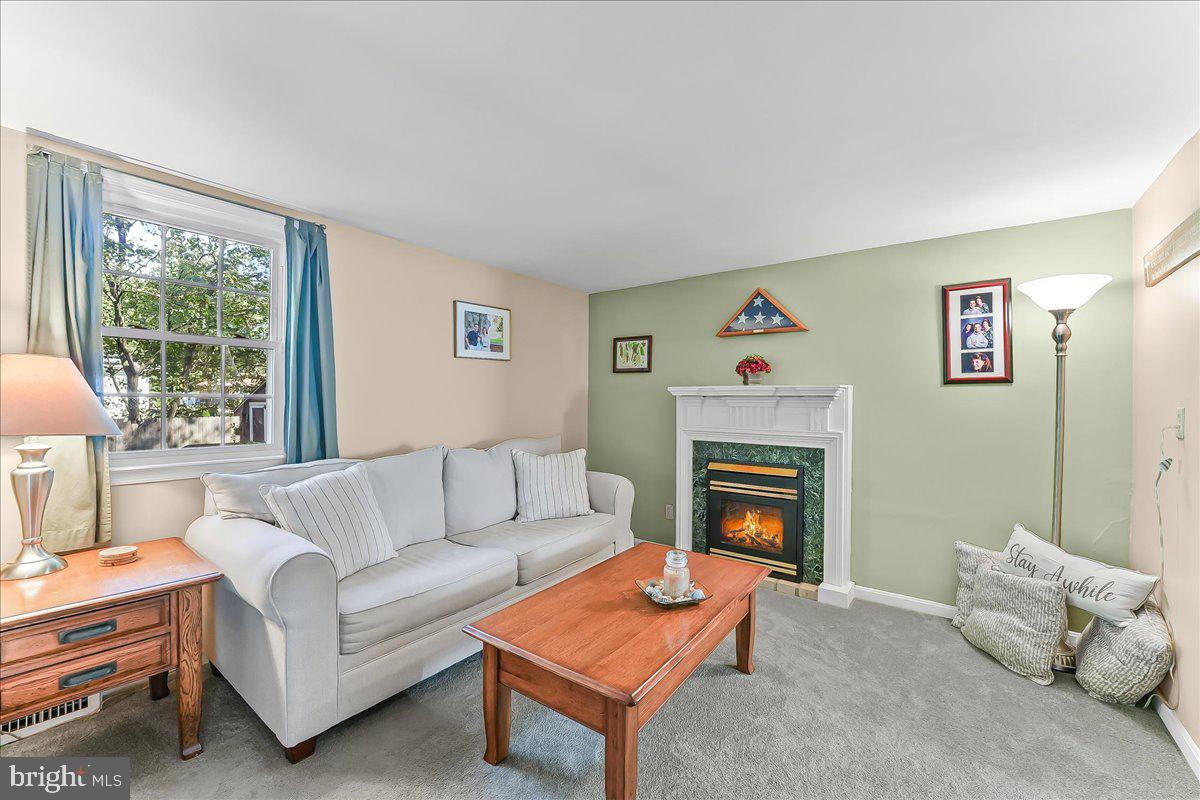 243 Rambling Way Springfield, PA 19064 - Photo 13 of 42 a living room with furniture and a fireplace