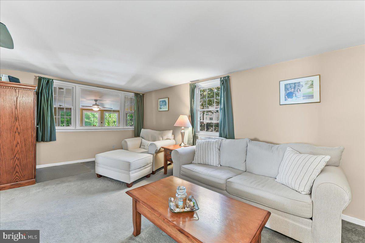 243 Rambling Way Springfield, PA 19064 - Photo 14 of 42 a living room with furniture and a large window