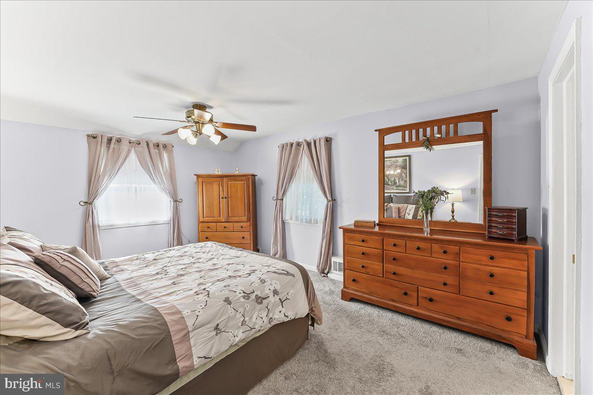 243 Rambling Way Springfield, PA 19064 - Photo 18 of 42 a bedroom with a bed and a dresser