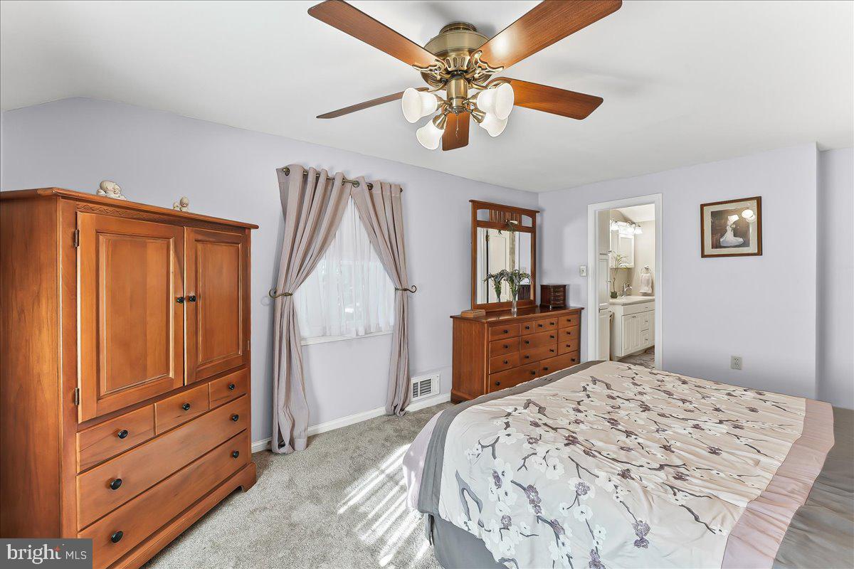 243 Rambling Way Springfield, PA 19064 - Photo 19 of 42 a bedroom with a bed and a dresser in it