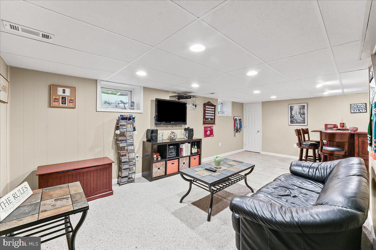243 Rambling Way Springfield, PA 19064 - Photo 29 of 42 a living room with furniture and a flat screen tv