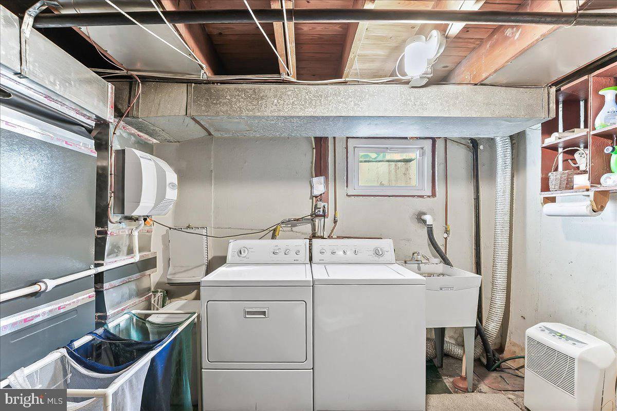 243 Rambling Way Springfield, PA 19064 - Photo 30 of 42 a utility room with dryer and washer