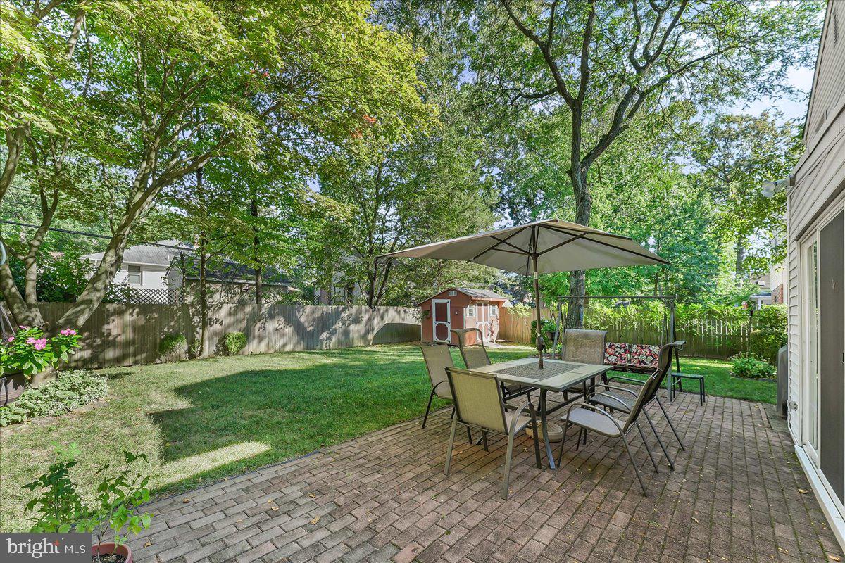 243 Rambling Way Springfield, PA 19064 - Photo 32 of 42 a view of backyard with seating and green space