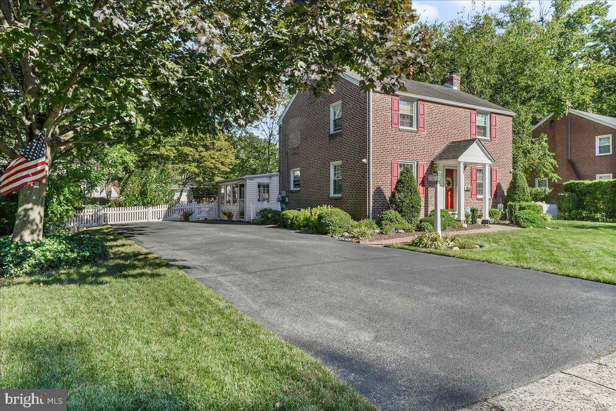 243 Rambling Way Springfield, PA 19064 - Photo 34 of 42 a front view of house with yard and trees