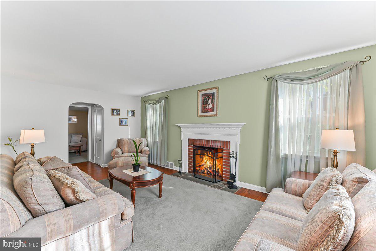 243 Rambling Way Springfield, PA 19064 - Photo 4 of 42 a living room with furniture and a fireplace