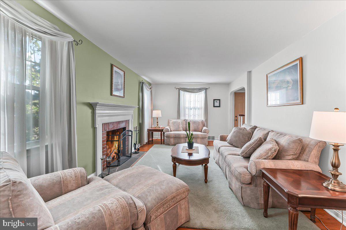 243 Rambling Way Springfield, PA 19064 - Photo 5 of 42 a living room with furniture and a fireplace
