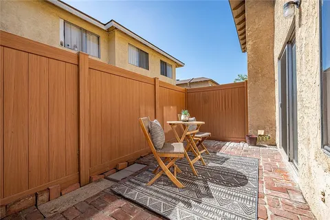 a patio with table and chairs
