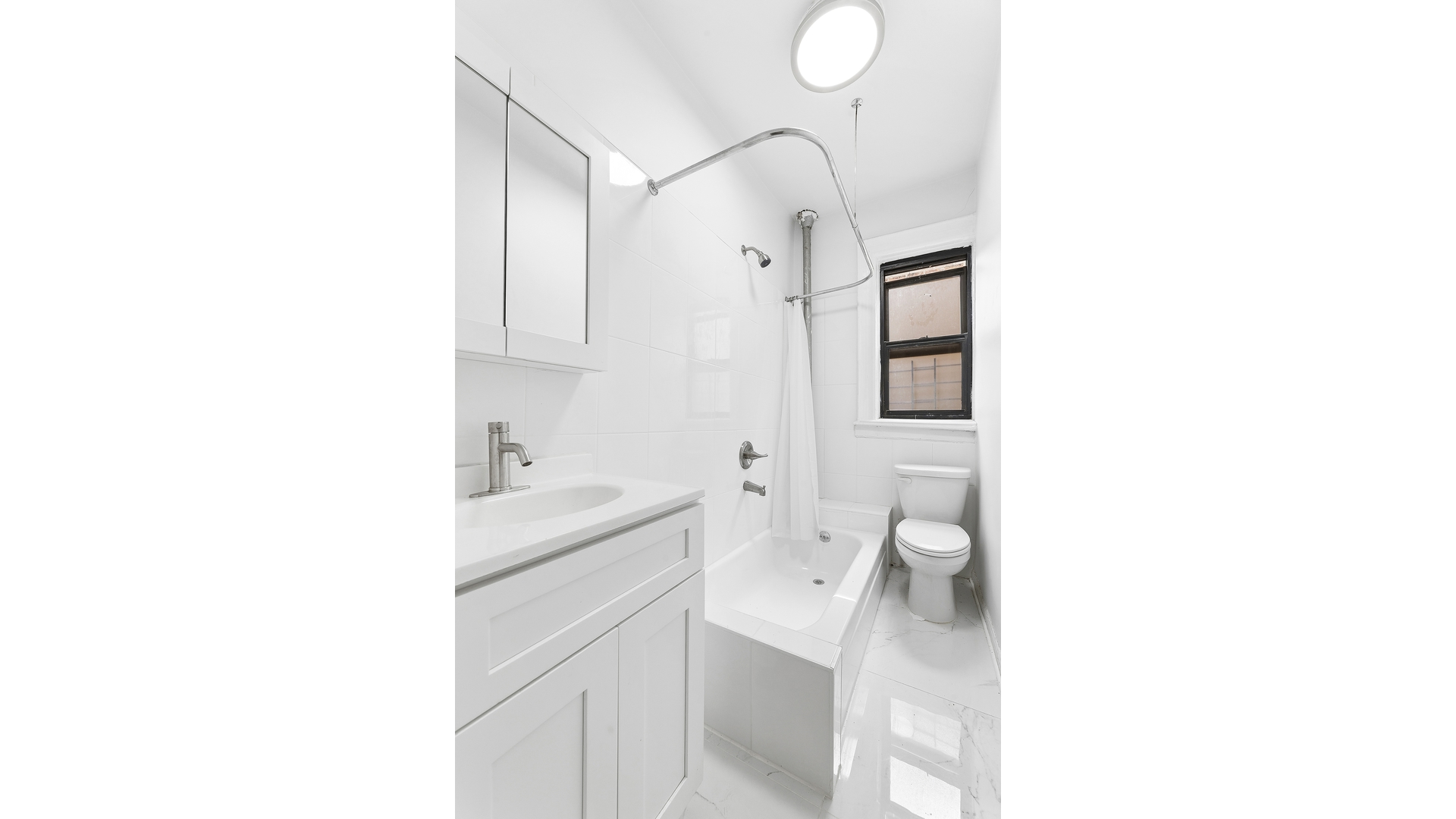 30 Macombs Place, Unit 54 Manhattan, NY 10039 - Photo 4 of 6 a bathroom with a sink toilet and shower