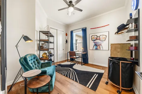 a work room with furniture and a window