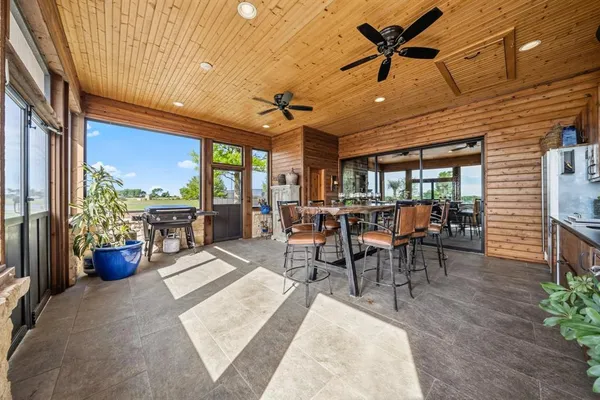 a view of a dining room with furniture window and outside view