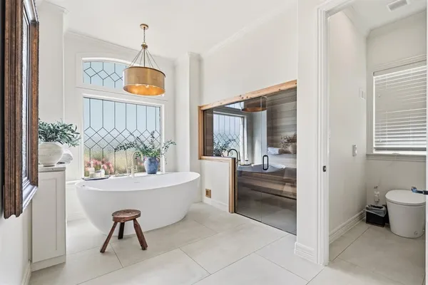 a dining room with furniture and a window