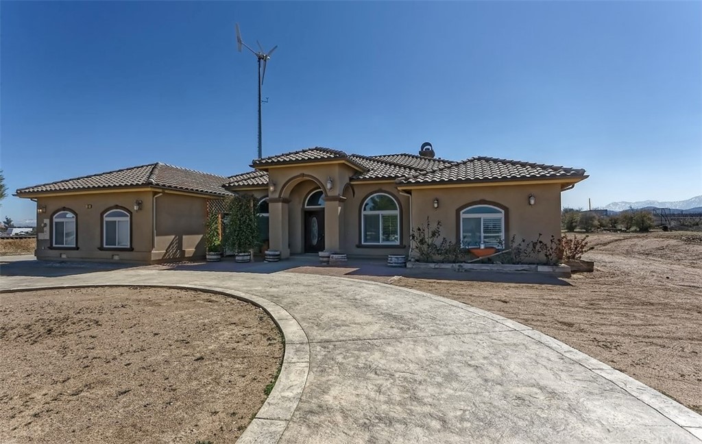 7323 Cygnet Road Phelan, CA 92371 - Photo 1 of 1 a front view of a house with a garden