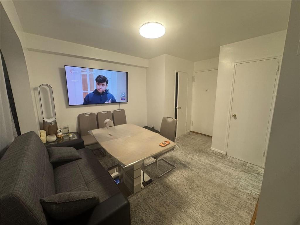 2400 East 3rd Street, Unit 317 Brooklyn, NY 11223 - Photo 3 of 8 a view of a livingroom with furniture and window