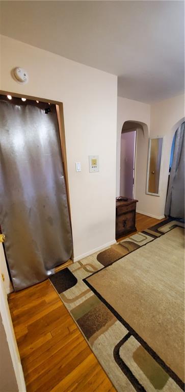 2400 East 3rd Street, Unit 317 Brooklyn, NY 11223 - Photo 4 of 8 a view of a room with gym equipment