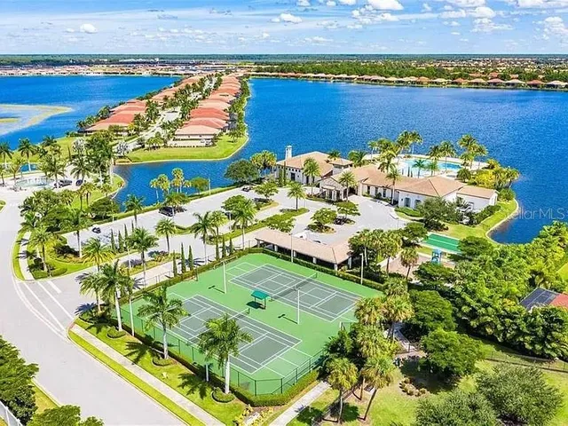 an aerial view of a pool patio swimming pool and outdoor seating