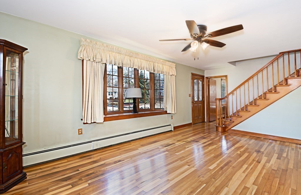 78 Lancaster Road Clinton, MA 01510 - Photo 11 of 29 a view of an empty room with wooden floor and a window