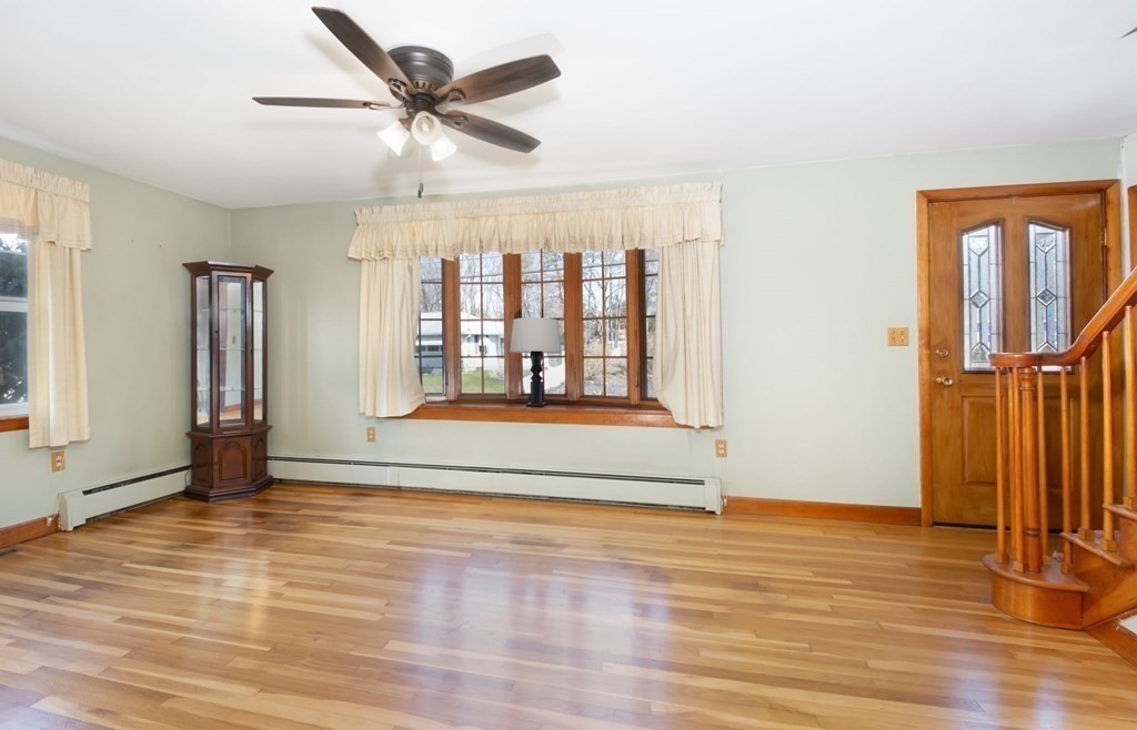 78 Lancaster Road Clinton, MA 01510 - Photo 10 of 29 a view of an empty room with window and wooden floor