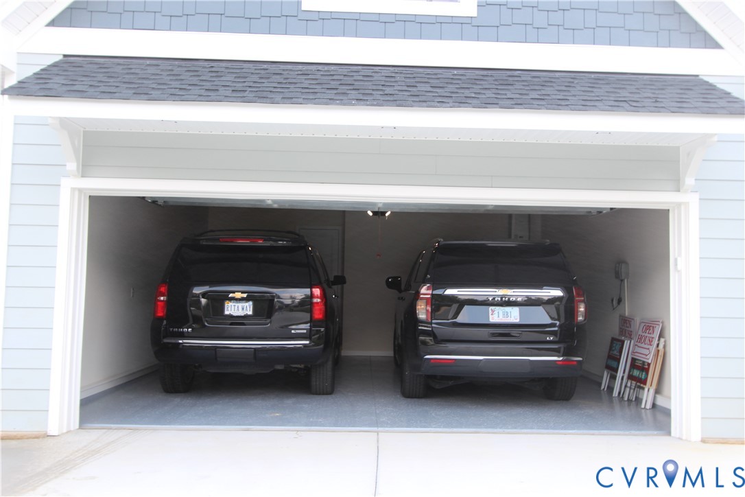 13107 Rodington Court Midlothian, VA 23113 - Photo 41 of 62 18' wide garage door makes it easy to park two lar