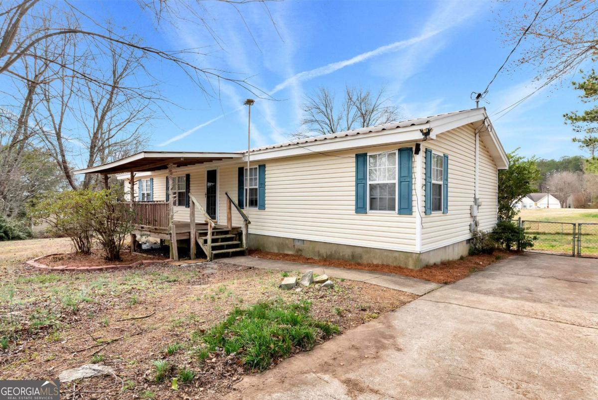 237 Hidden Acres Road Winder, GA 30680 - Photo 1 of 1 a view of a house with yard and furniture
